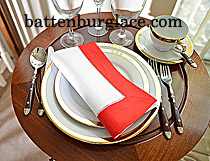White Hemstitch Napkin with Red colored Trims.